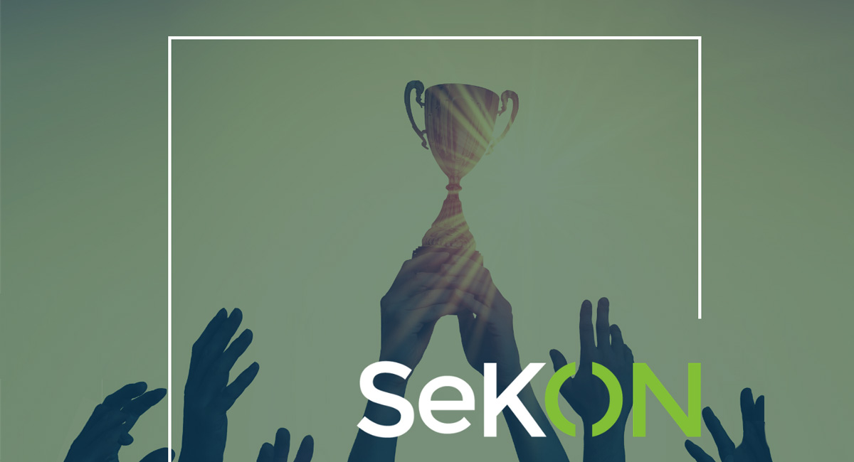 Hands holding up a trophy with the Sekon logo at the bottom