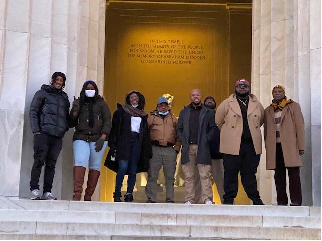 Interns on the steps of the Lincoln Memorial